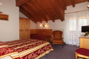 Postel nebo postele na pokoji v ubytování Hotel Garnì Villanova