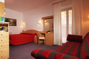 Postel nebo postele na pokoji v ubytování Hotel Garnì Villanova