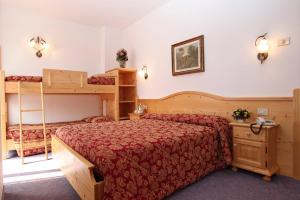 Postel nebo postele na pokoji v ubytování Hotel Garnì Villanova