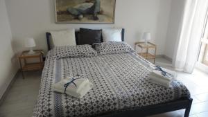 Ένα ή περισσότερα κρεβάτια σε δωμάτιο στο New Flat in the Heart of Pozzuoli