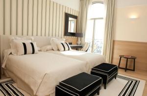 Кровать или кровати в номере Gran Hotel Sardinero