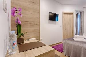 TV a/nebo společenská místnost v ubytování Central Pearl by Nono Ban Rooms