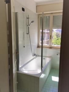 a bath tub in a bathroom with a window at Attico vista mare in Pescara +40 photos