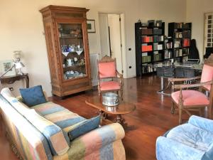 a living room with a couch and chairs and a table at Attico vista mare in Pescara