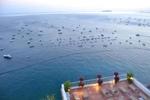an aerial view of a large body of water with boats at Hotel Marincanto in Positano
