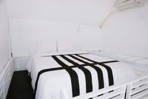 Postel nebo postele na pokoji v ubytování Vande Guest House