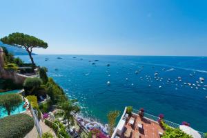 a view of a beach with boats in the water at Hotel Marincanto in Positano