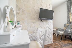 TV a/nebo společenská místnost v ubytování Villa Trau d`oro
