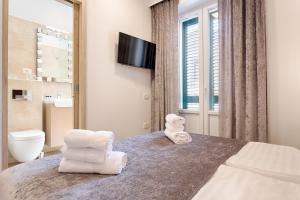 Koupelna v ubytování Central Pearl by Nono Ban Rooms + 35 fotografií