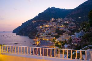 a view of a town on a hill next to the water at Hotel Marincanto in Positano