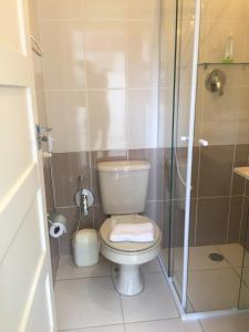 Um banheiro em Vila Stellino Suítes