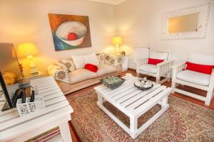 a living room with a couch and a table at Montagu Four Seasons in Montagu