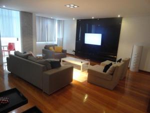 a living room with two couches and a flat screen tv at Luxury 3 Bedroom Apartment - Barra in Salvador