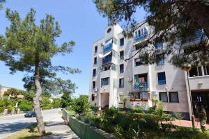 a building on the side of a street at Leut Apartment, 3min beach, 15min center in Pula