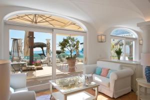 a living room with a view of the ocean at Hotel Marincanto in Positano