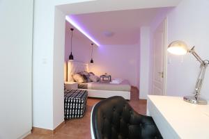 a bedroom with a bed with a purple ceiling at Monte & Paradiso in Pula