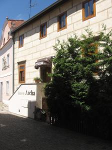a building with a sign on the side of it at Pension Archa in Znojmo
