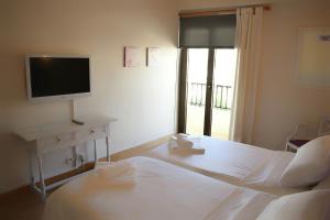 Postel nebo postele na pokoji v ubytování Hotel Marbel