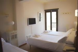 Postel nebo postele na pokoji v ubytování Hotel Marbel