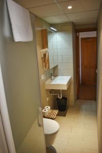 Koupelna v ubytování Hotel Marbel