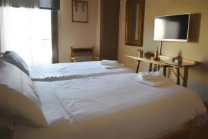 Postel nebo postele na pokoji v ubytování Hotel Marbel