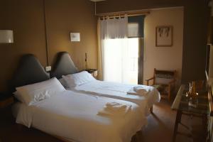 Postel nebo postele na pokoji v ubytování Hotel Marbel