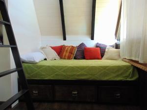 Una cama o camas en una habitación de Cabañas Xibi Xibi