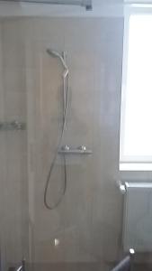 a shower in the corner of a bathroom at La Caramidari Bucuresti in Bucharest