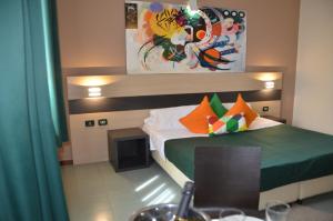 Postel nebo postele na pokoji v ubytování Hotel Alba Roma