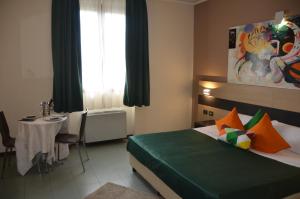 Postel nebo postele na pokoji v ubytování Hotel Alba Roma