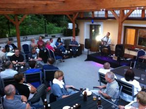 a group of people sitting in chairs listening to a speaker at Willa BALTAZAR in Lubniewice