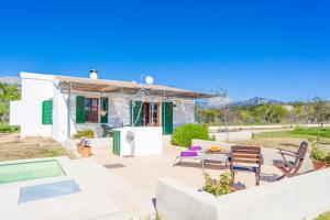 a house with a patio and a swimming pool at Ses Planes - Adults Only ( Ca Na Faustina) in El Port de la Selva