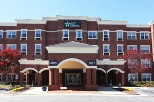 an exterior view of a red brick building at Extended Stay America Suites - Greensboro - Airport in Greensboro