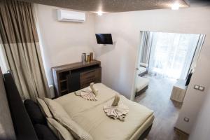Posteľ alebo postele v izbe v ubytovaní All Seasons Apartment