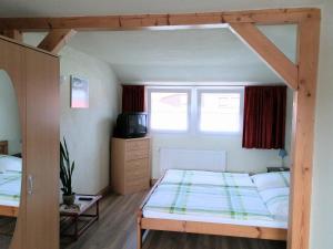 מיטה או מיטות בחדר ב-Ferienhaus Wille