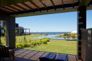 a view from the patio of a house with a view of a yard at Bahia Vik in José Ignacio