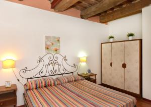 Postel nebo postele na pokoji v ubytování Agriturismo Tenuta Vallelunga