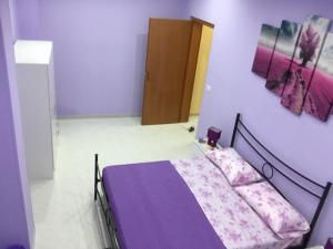 Posteľ alebo postele v izbe v ubytovaní La Casa di Simone