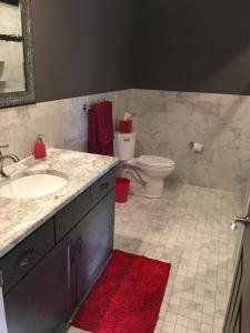 a bathroom with a sink and a toilet at Irish American INN in Newport