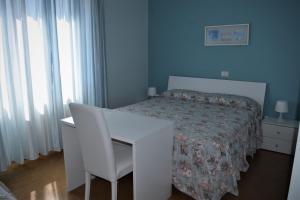 Letto o letti in una camera di Albergo De Jean