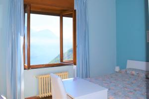 Letto o letti in una camera di Albergo De Jean