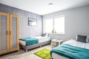 Voodi või voodid majutusasutuse Tetris Sopot toas