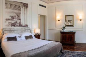 Кровать или кровати в номере Albergo Terminus