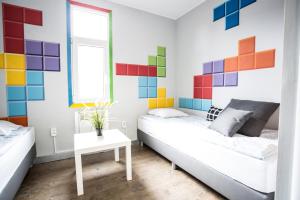 Postel nebo postele na pokoji v ubytování Tetris Sopot