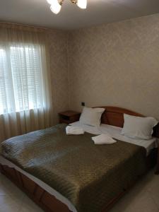 Postel nebo postele na pokoji v ubytování Family Hotel Kartala