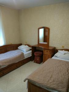 Postel nebo postele na pokoji v ubytování Family Hotel Kartala
