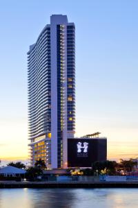 a large building with a large clock on top of it at Hyde Resort & Residences in Hollywood
