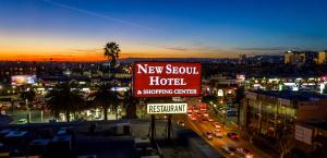 a sign for a new soul hotel and shopping center at Olyver Hotel in Los Angeles