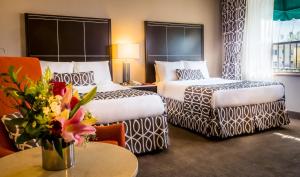 Ένα ή περισσότερα κρεβάτια σε δωμάτιο στο New Seoul Hotel