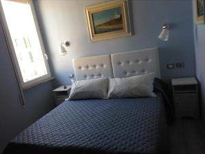 Postel nebo postele na pokoji v ubytování Casa Garibaldi